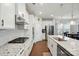 Stylish kitchen boasts stainless steel appliances, granite counters, and ample cabinet space at 1825 Lotus Ln, Denver, NC 28037