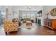 Inviting living room with plush seating, a fireplace, and large windows providing ample natural light at 1825 Lotus Ln, Denver, NC 28037