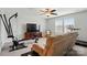 Spacious living room features neutral walls, carpet, ceiling fan, tv, and home gym at 1825 Lotus Ln, Denver, NC 28037