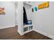 Charming mudroom with a built-in bench, storage hooks, and decorative accents to keep the space organized at 1825 Lotus Ln, Denver, NC 28037