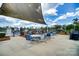 Patio area features outdoor seating and sunshades near the pool, perfect for relaxing at 1825 Lotus Ln, Denver, NC 28037