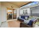Cozy screened-in patio with comfortable seating, a woven rug, and an outdoor view at 1825 Lotus Ln, Denver, NC 28037