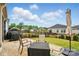 Inviting patio space with outdoor seating, umbrella, and a grill, ideal for relaxing outdoors at 1825 Lotus Ln, Denver, NC 28037