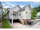 Well-kept backyard featuring an inviting back porch, manicured lawn, and convenient outdoor grilling space at 1830 Wickford Pl, Charlotte, NC 28203