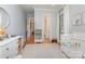 Bright Bedroom featuring white trim, hardwood floors, ample storage, and modern decor at 1830 Wickford Pl, Charlotte, NC 28203