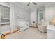Serene Bedroom featuring a white crib, glider, and soft, neutral tones at 1830 Wickford Pl, Charlotte, NC 28203