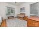 Well-lit Bedroom with hardwood floors, neutral tones, stylish decor, and two large windows at 1830 Wickford Pl, Charlotte, NC 28203