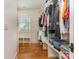 Walk-in closet with built-in shelving, ample storage, and natural light at 1830 Wickford Pl, Charlotte, NC 28203