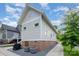 Charming exterior view featuring a well-maintained yard, and a convenient outdoor grilling area at 1830 Wickford Pl, Charlotte, NC 28203