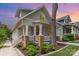 Charming two-story home with gray siding, brick accents, and a welcoming front porch at 1830 Wickford Pl, Charlotte, NC 28203