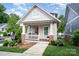 Charming home with welcoming front porch and manicured lawn at 1830 Wickford Pl, Charlotte, NC 28203