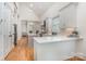 Bright kitchen with white cabinets, stainless steel appliances, a center island, and hardwood floors at 1830 Wickford Pl, Charlotte, NC 28203