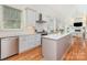 Open kitchen with stainless steel appliances and bright living area at 1830 Wickford Pl, Charlotte, NC 28203