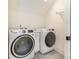 Bright laundry room featuring a new washer and dryer set with a cabinet at 1830 Wickford Pl, Charlotte, NC 28203