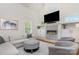 Bright living room showcases a stone fireplace, built-in cabinets, and stylish furniture with fireplace lit at 1830 Wickford Pl, Charlotte, NC 28203