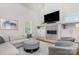 Bright living room showcases a stone fireplace, built-in cabinets, and stylish furniture at 1830 Wickford Pl, Charlotte, NC 28203