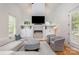 Stylish living room features a stone fireplace, built-in cabinets, and comfortable seating at 1830 Wickford Pl, Charlotte, NC 28203