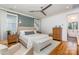 Elegant main bedroom with paneled accent wall, seating area, and ensuite bathroom at 1830 Wickford Pl, Charlotte, NC 28203