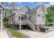 Charming home with a rear exterior featuring a lovely deck and well-maintained landscaping at 1830 Wickford Pl, Charlotte, NC 28203