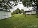 Backyard featuring lush greenery, shed, and a serene outdoor space at 2009 Hickory Grove Rd, Gastonia, NC 28056