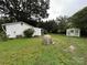 Green backyard featuring lush greenery, shed, and serene outdoor space at 2009 Hickory Grove Rd, Gastonia, NC 28056