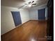 Large bedroom with hardwood floors, a ceiling fan, and lots of natural light plus ample storage at 2009 Hickory Grove Rd, Gastonia, NC 28056