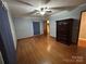 Large bedroom with hardwood floors, a ceiling fan, and lots of natural light plus ample storage at 2009 Hickory Grove Rd, Gastonia, NC 28056
