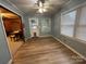 Bright dining room with wood floors and natural light with a view to the backyard at 2009 Hickory Grove Rd, Gastonia, NC 28056