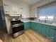 Charming kitchen with stainless steel appliances, bright countertops, and wood-look flooring at 2009 Hickory Grove Rd, Gastonia, NC 28056