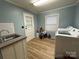 Laundry room includes a utility sink and plenty of space for laundry needs at 2009 Hickory Grove Rd, Gastonia, NC 28056