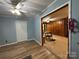 Living room with wood floors and light-blue walls provides a tranquil space with archway to dining room at 2009 Hickory Grove Rd, Gastonia, NC 28056