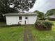 Charming white shed with a classic design, complemented by a flower box and a well-maintained lawn at 2009 Hickory Grove Rd, Gastonia, NC 28056