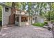 Backyard featuring a brick patio, screened porch, and detached garage at 201 Scalybark Trl, Concord, NC 28027