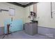 Basement featuring a drill press, workbench, and painted block walls at 201 Scalybark Trl, Concord, NC 28027