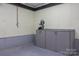 Basement featuring workbench, painted block walls, and green trim at 201 Scalybark Trl, Concord, NC 28027