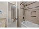 Stylish bathroom with tiled shower, tub, and open doorway to stairs at 201 Scalybark Trl, Concord, NC 28027