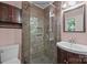 Tiled bathroom features a glass shower and stylish vanity with a mirror at 201 Scalybark Trl, Concord, NC 28027