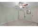 Neutral bedroom with ceiling fan, carpet, and view of closet at 201 Scalybark Trl, Concord, NC 28027