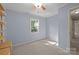 Bright bedroom with carpet flooring and sunlit window, creating a peaceful retreat at 201 Scalybark Trl, Concord, NC 28027