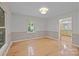 Well-lit dining room features hardwood floors and access to the kitchen at 201 Scalybark Trl, Concord, NC 28027