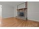 Charming brick fireplace with wood mantle and glass doors for a cozy atmosphere at 201 Scalybark Trl, Concord, NC 28027