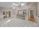 Bright sunroom features tile floor, wainscotting and views of the backyard at 201 Scalybark Trl, Concord, NC 28027