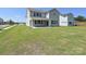 Expansive backyard with lush green lawn and a covered patio, perfect for outdoor entertaining at 2046 Sabra St # Cwo0006, Gastonia, NC 28054