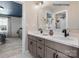Stylish bathroom featuring a double sink vanity with modern fixtures and decor, bright natural light, and ceramic tile flooring at 2046 Sabra St # Cwo0006, Gastonia, NC 28054