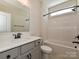 Bathroom featuring a vanity with sink and a shower-tub combo with white tiles at 2046 Sabra St # Cwo0006, Gastonia, NC 28054