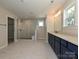 Open bathroom featuring double vanities and a glass enclosed shower with tile surround at 2046 Sabra St # Cwo0006, Gastonia, NC 28054