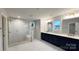 Modern bathroom with a glass enclosed shower, dual vanities, and neutral tiling throughout at 2046 Sabra St # Cwo0006, Gastonia, NC 28054