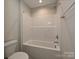 Clean bathroom featuring a shower-tub combination with white tile surround and modern fixtures at 2046 Sabra St # Cwo0006, Gastonia, NC 28054