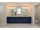 Bright bathroom featuring double vanities and a glass enclosed shower with tile surround at 2046 Sabra St # Cwo0006, Gastonia, NC 28054