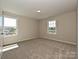Bright bedroom with large windows, providing ample natural light and a pleasant view at 2046 Sabra St # Cwo0006, Gastonia, NC 28054